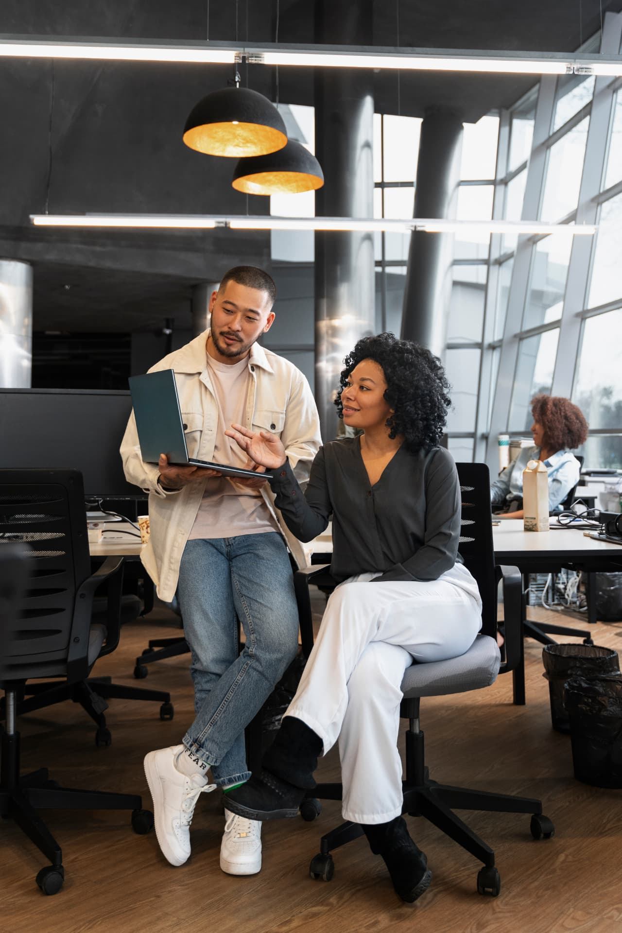 A BoostPro Media specialist reviewing campaign performance with a client
